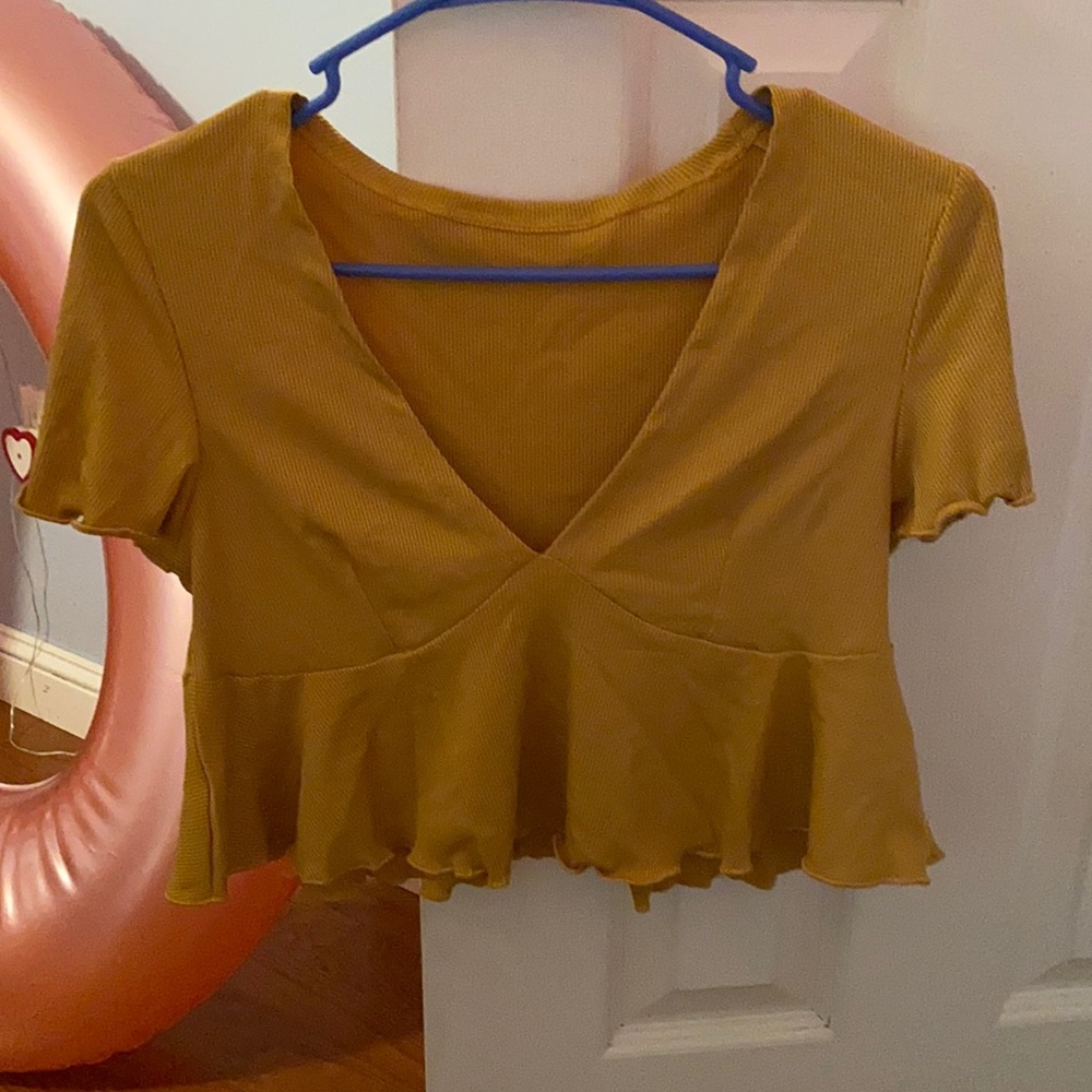 Small yellow shirt. Never worn